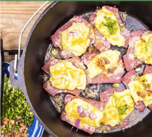 Dutch Oven Stuffed Sausage and Potato Boats