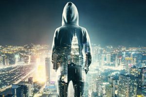 Guy-In-Hoodie-Looking-Over-Cityscape