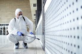 Man-In-Tyvek-Suit-Cleaning-Up-A-Contaminated-Room