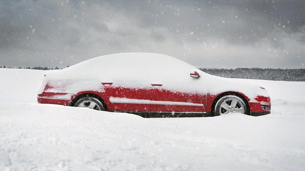 car-stuck-in-snowy-road