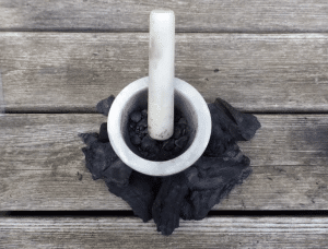 Mortar-And-Pestle-To-Grind-Charcoal-Into-Dust